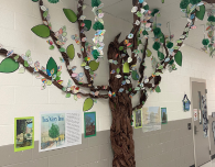  A paper machete tree looms large outside the Donelson Elementary library to showcase lessons in res